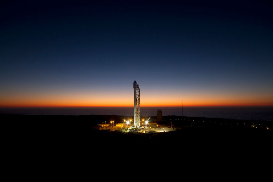 A rocket standing on its launch pad against a twilight sky, representing the surge in new equity listings entering public markets.