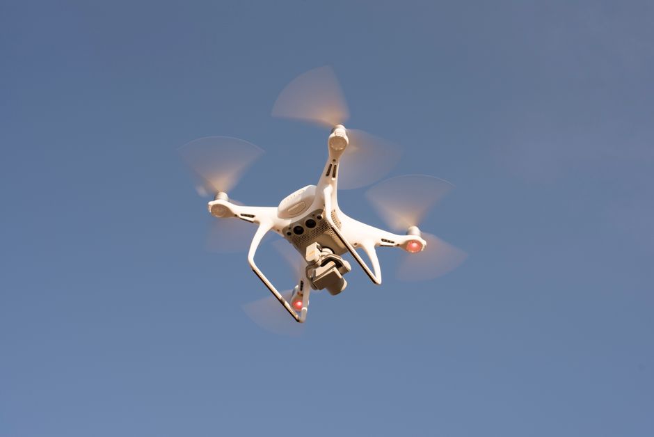 A drone in flight against a clear sky
