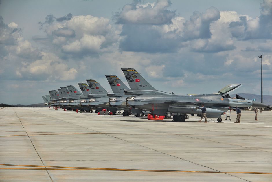 Turkish Air Force F-16 fighter jets parked on an airbase tarmac