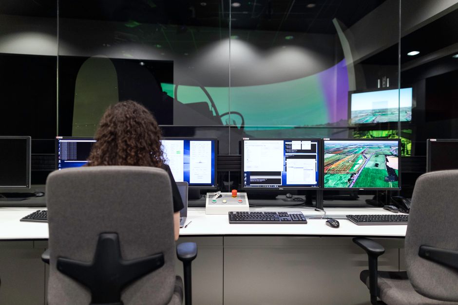 Engineer managing multiple software and infrastructure screens