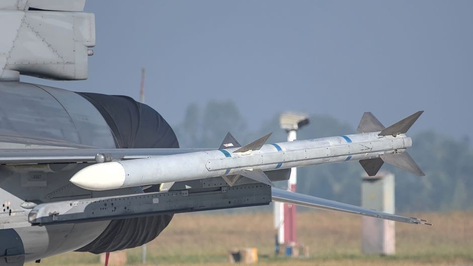 Close-up of a missile mounted on a military aircraft wing