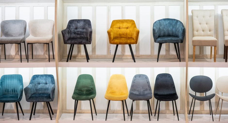 A modern furniture showroom displays a range of dining chairs