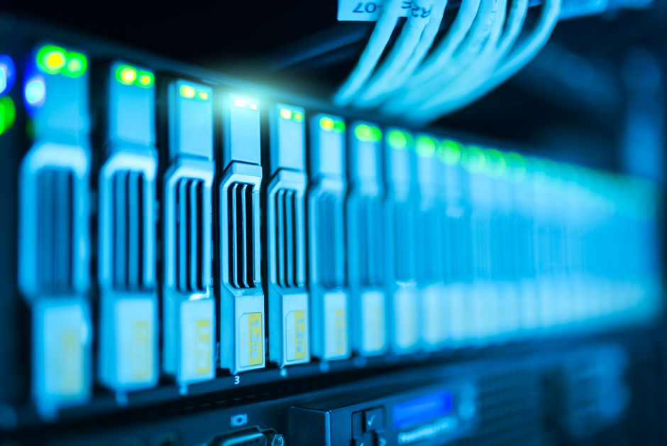 Close-up of server racks with glowing lights in a modern data center