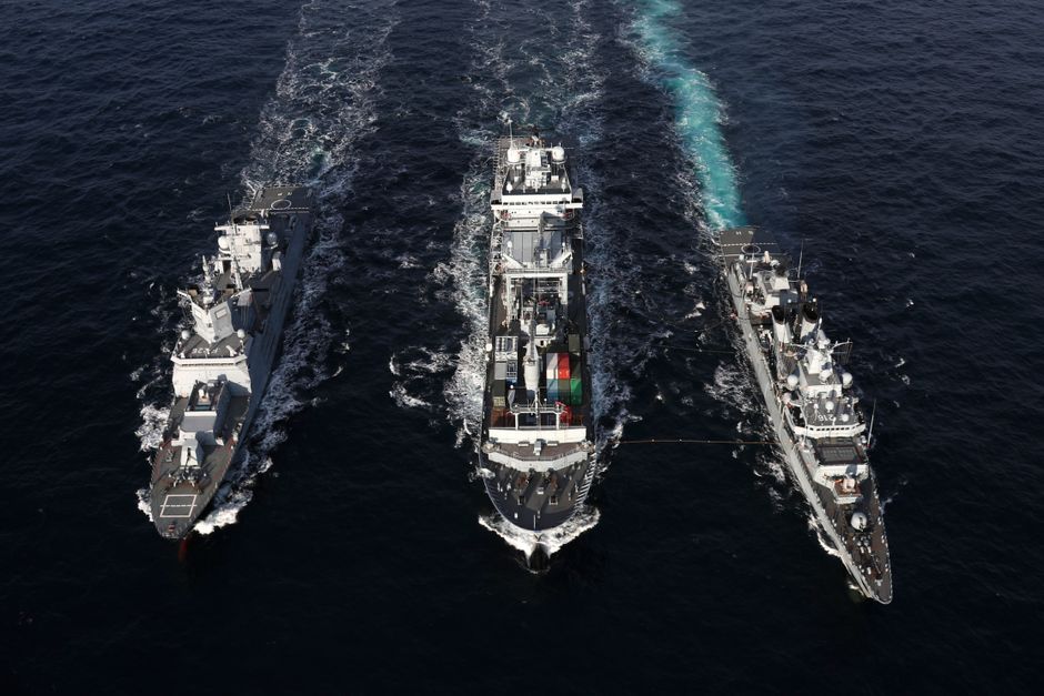 Naval ships sailing in formation on open sea, illustrating the maritime blockade and naval enforcement operations at the center of the Iran-Hormuz crisis.