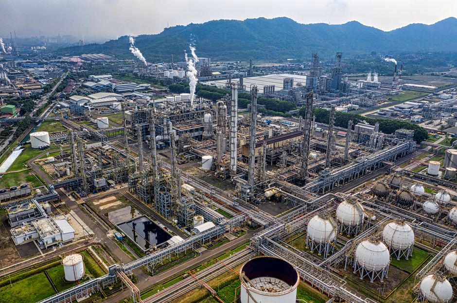 An aerial refinery view represents the infrastructure required to move and process substitute energy supplies.