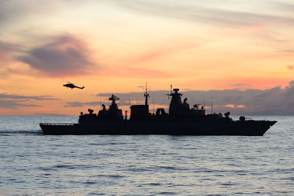 Silhouette of a warship at sea