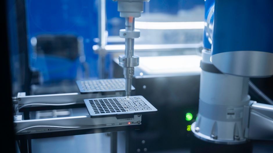 Robotic arm performing precision automation in a laboratory setting