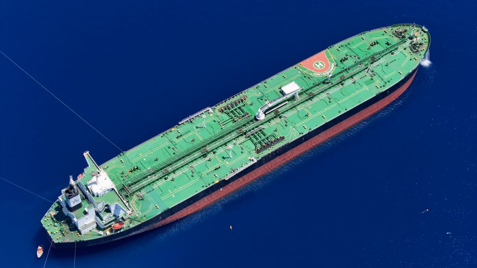 Aerial view of a large oil tanker navigating open ocean waters, illustrating maritime crude transport through strategic shipping lanes.