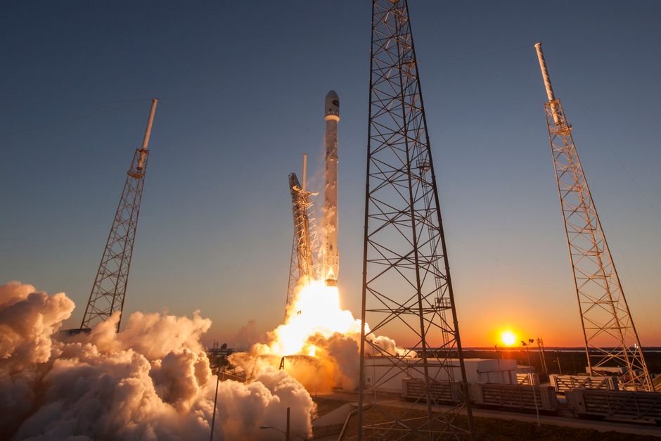 A modern space rocket lifting off against a sunset sky, symbolizing aerospace technology and public market debuts.