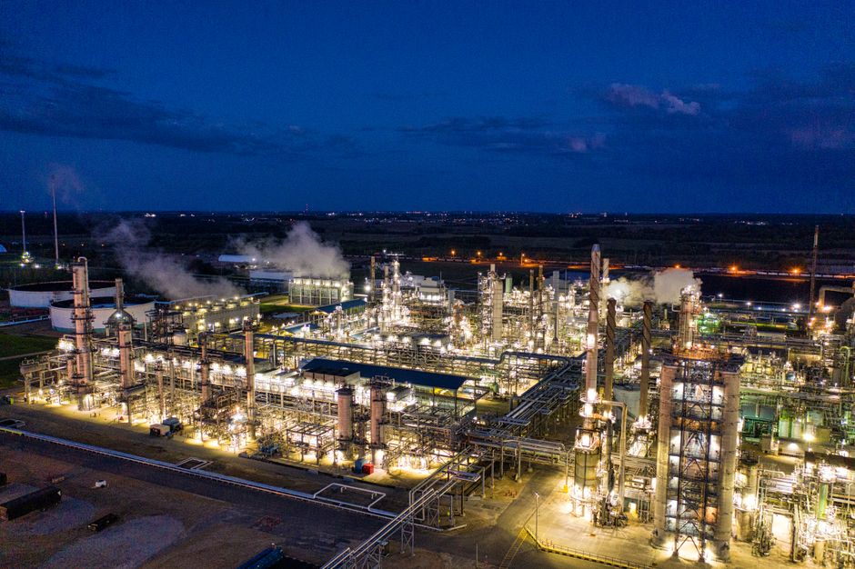 An illuminated oil refinery complex at night