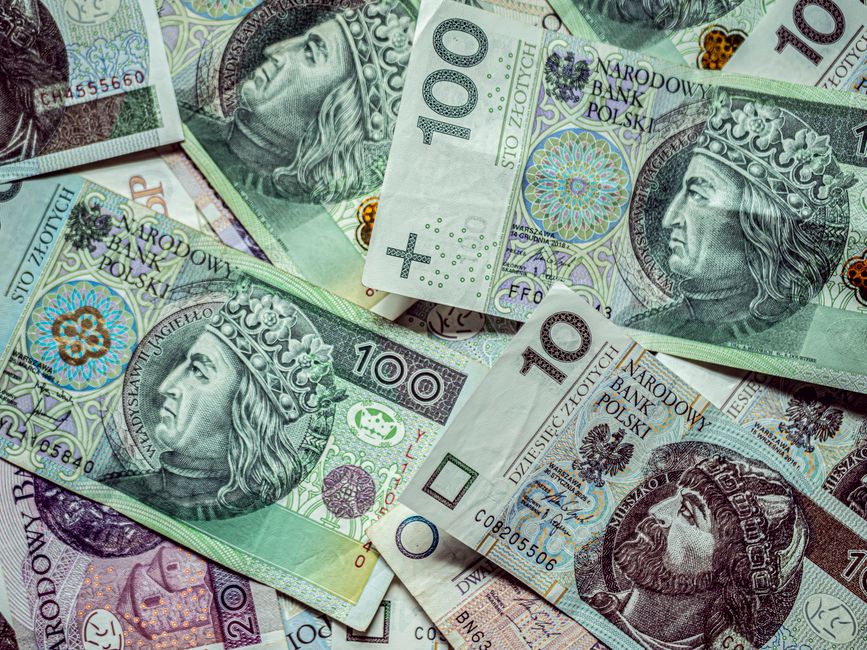 Close-up of various currency banknotes, displaying finance and monetary policy themes.