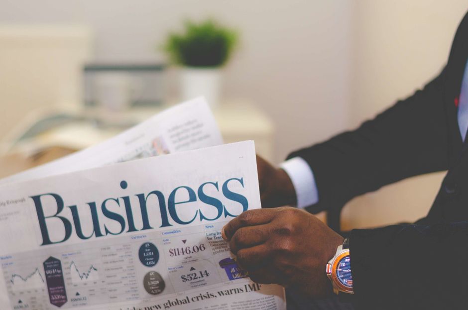 Business newspaper with financial headlines