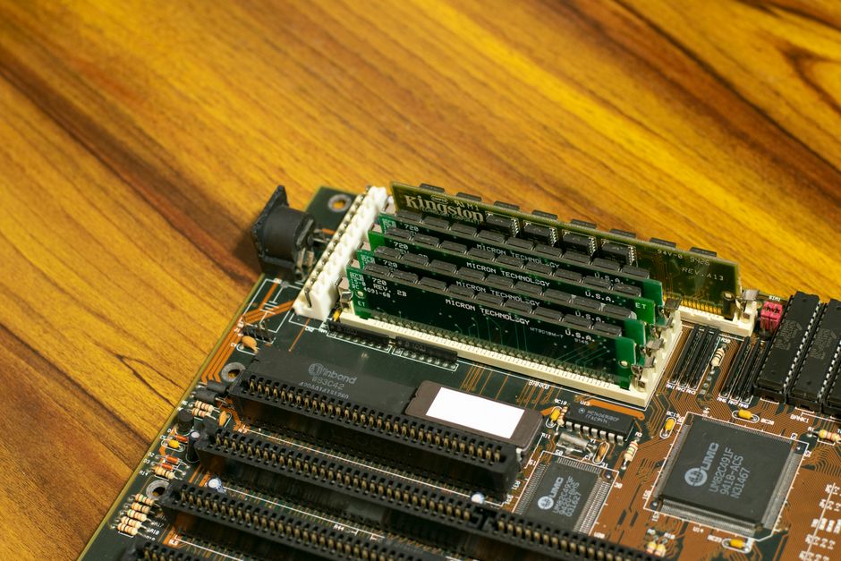 Close-up macro photograph of computer memory modules and circuitry on a motherboard, representing semiconductor manufacturing at the center of the 2026 AI-driven issuance wave.