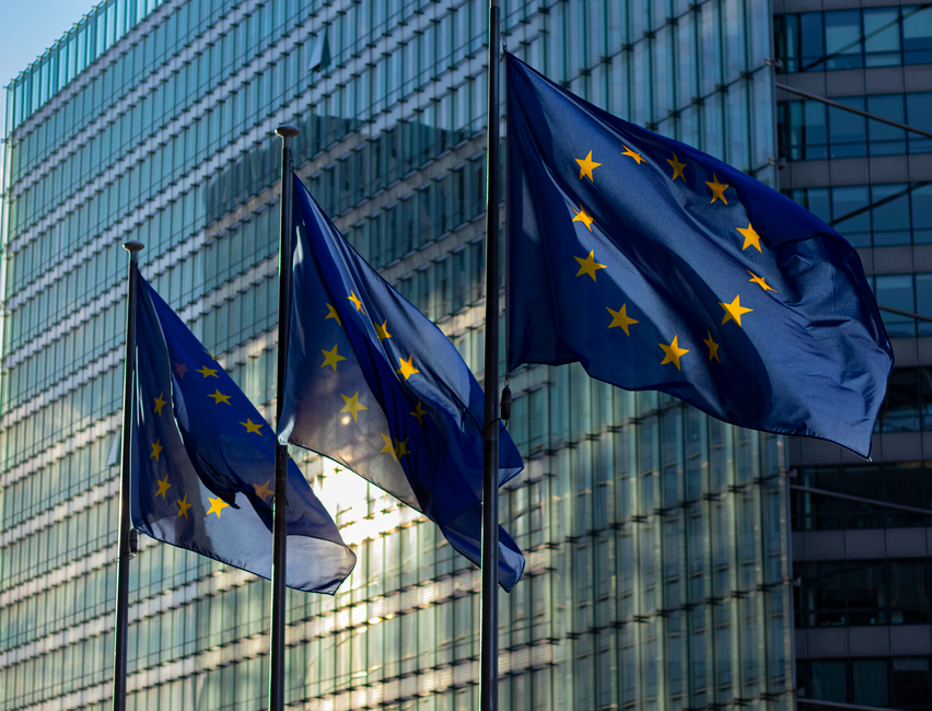 EU flags flying outside the European Commission headquarters in Brussels