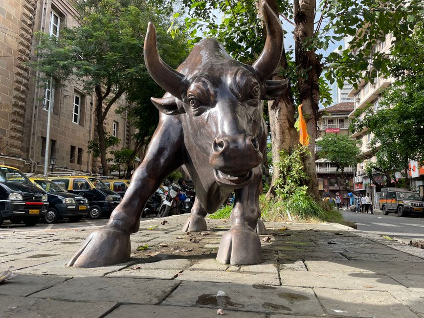 Bronze bull statue in a financial district