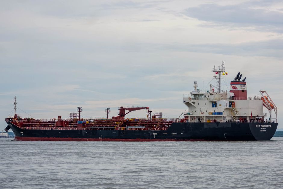Large oil tanker sailing on the open sea under cloudy skies