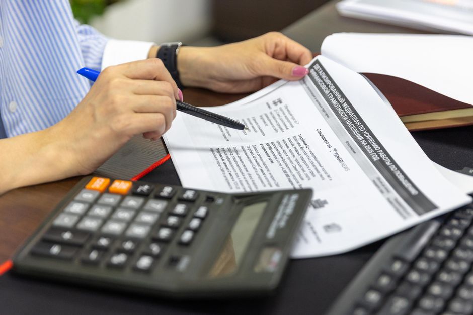 Close-up of financial documents and calculations related to an equity offering.