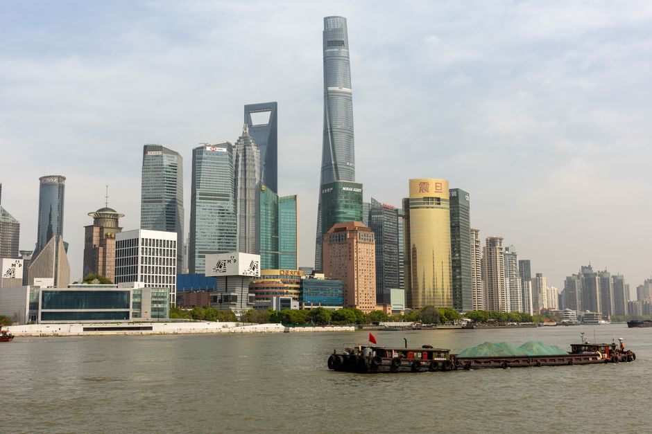 Skyline view of the Lujiazui financial district in Shanghai, China, with iconic skyscrapers along the Huangpu River.