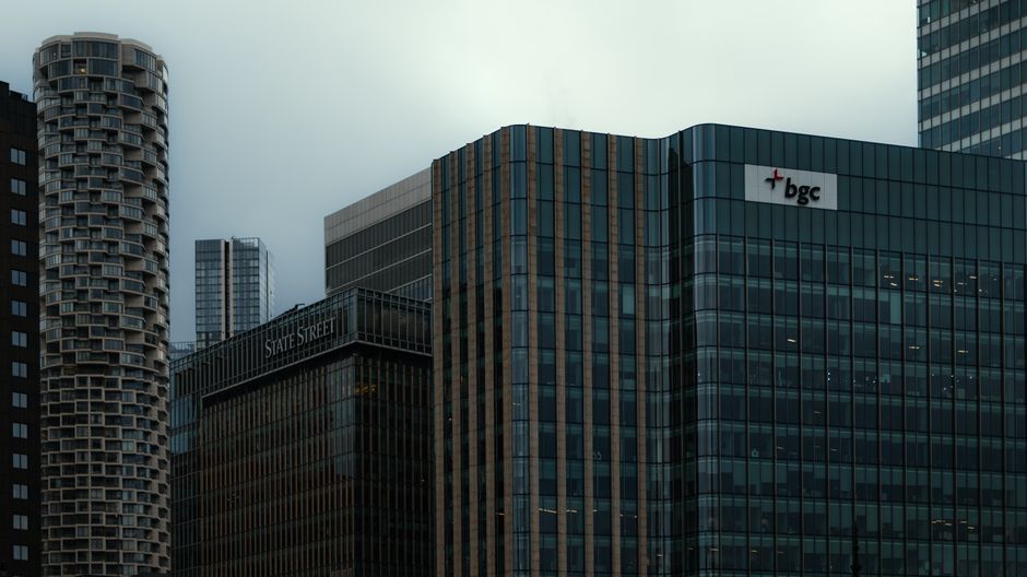 Modern financial-district skyscrapers representing the infrastructure behind public capital markets