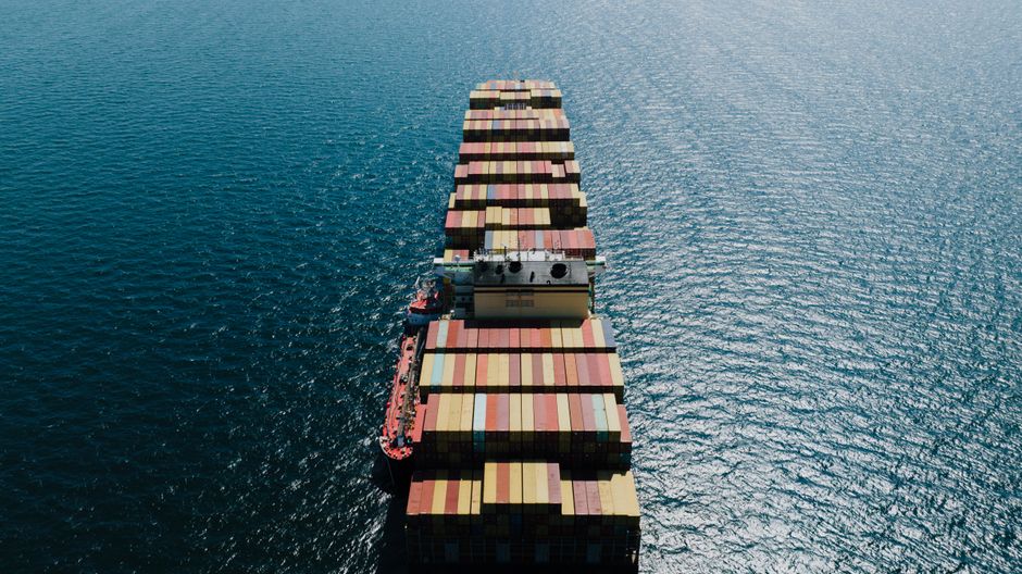 Cargo ship sailing through open sea