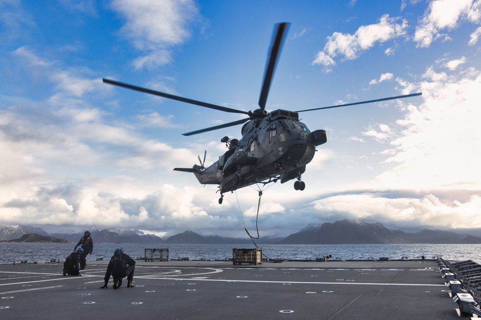 Military helicopter on naval vessel