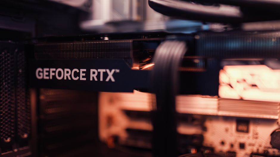 Detailed view of a GeForce RTX graphics card installed in a computer setup, highlighting modern GPU technology.