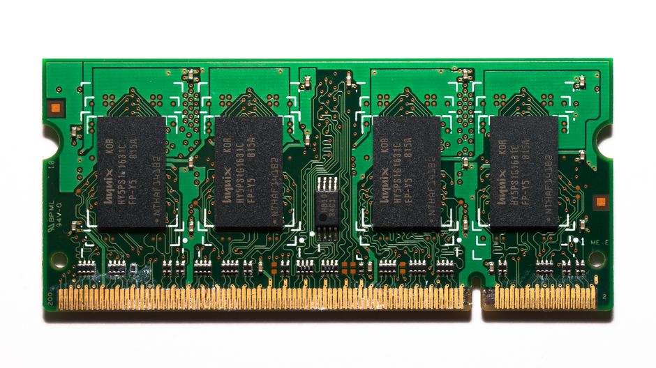Close-up of a computer motherboard with RAM modules and intricate circuit pathways, representing semiconductor manufacturing and memory chip supply.