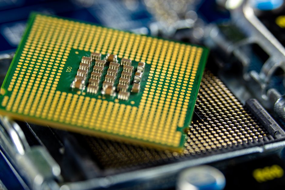 Close-up of a computer microprocessor on a motherboard, showing intricate circuitry.
