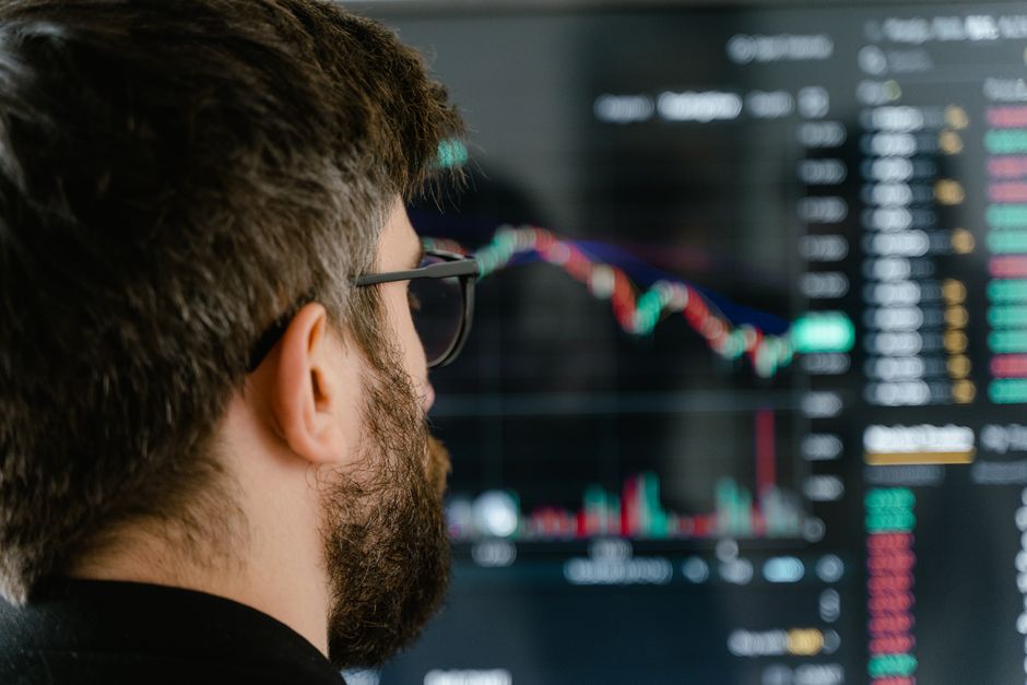Trader analyzing market data on screen